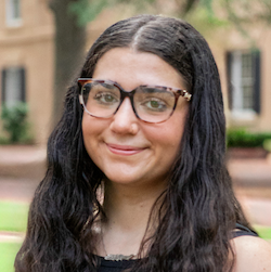 girl with glasses smiling