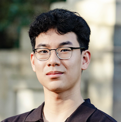 boy with glasses smiling