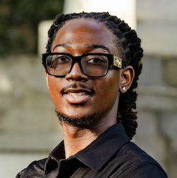 boy with glasses smiling