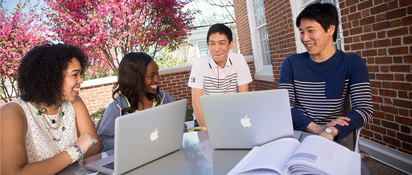 journalism students studying outside