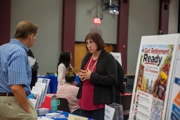 Vendor helping staff at expo