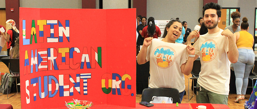 Laso students in front of sign 