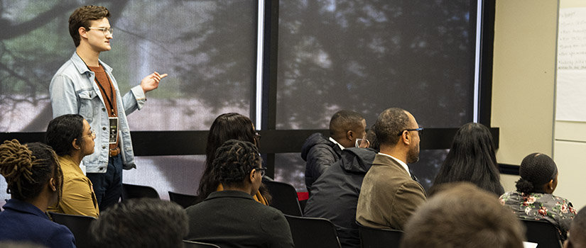 A student presents in a Russell House meeting room