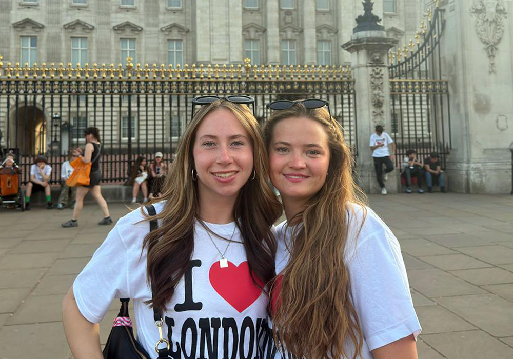 Students Marley Greenwood and Lindsay Gilbert outside Buckingham Palace