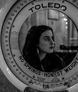 black and white photo of a woman with long dark hair