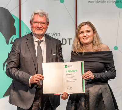 a man and woman holding an award