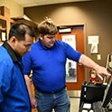 Ben Meekins and student in lab