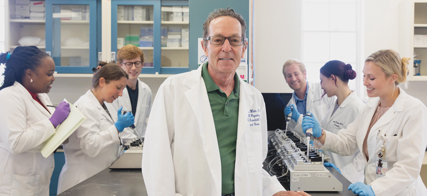 Clinton Webb in lab with students