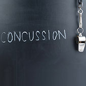 Word concussion written on chalkboard