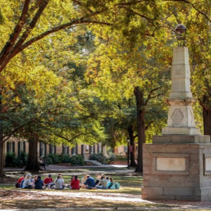 Students sit on the USC Horseshoe