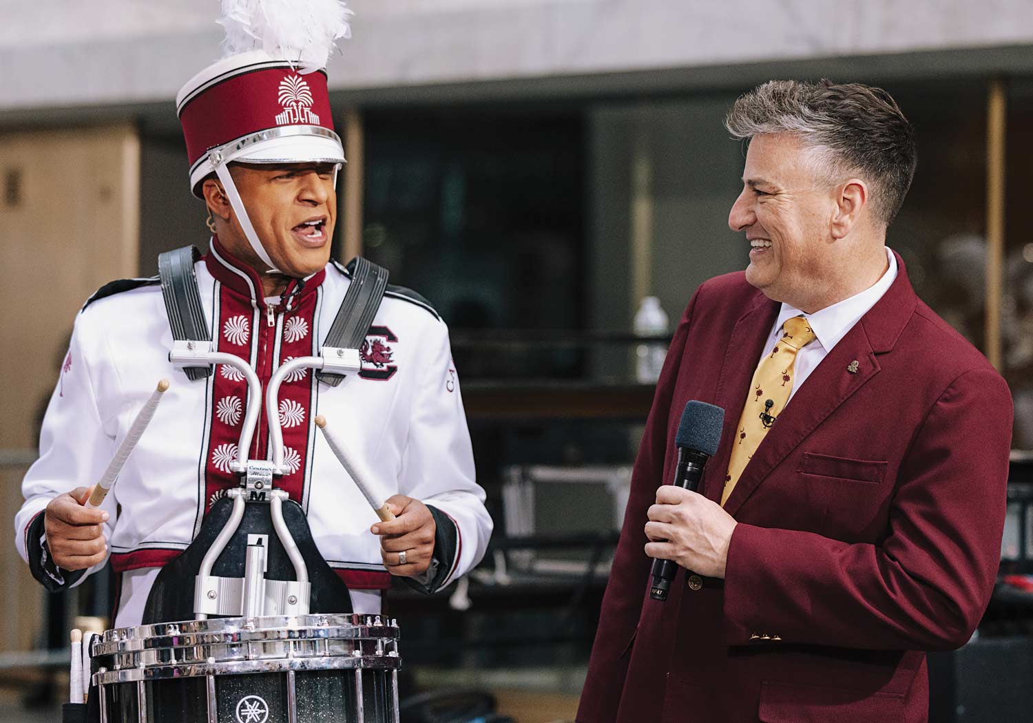 Craig Melvin, who became an honorary Carolina band­member for a segment NBC’s TODAY, speaks with Carolina Band Director Jay Jacobs.